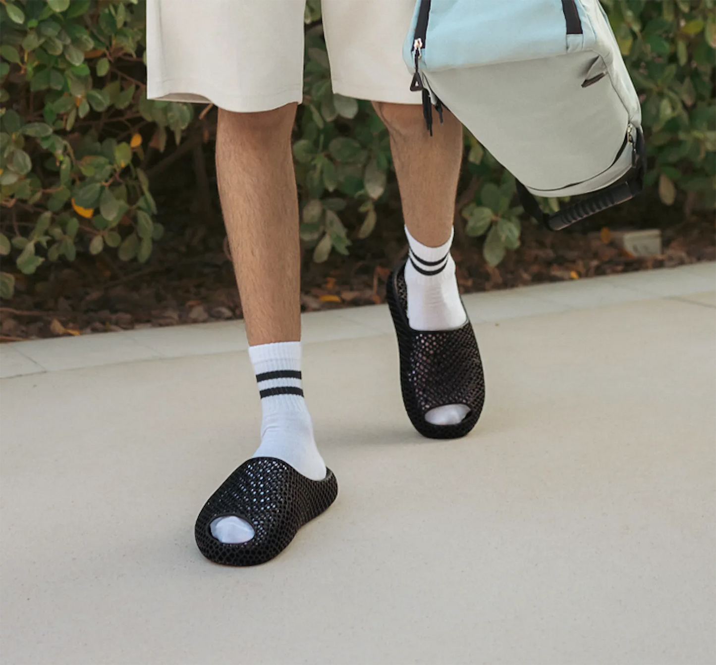 Model wearing versatile minimalist slides