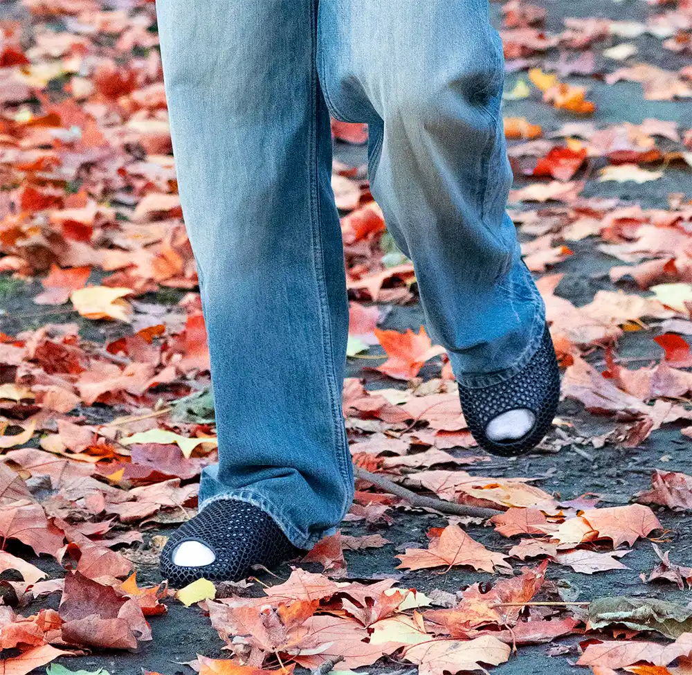 Model wearing versatile minimalist slides