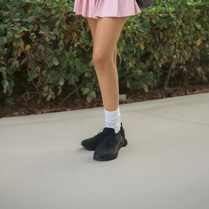 Model wearing Waterproof 3D Print Shoes in True Black